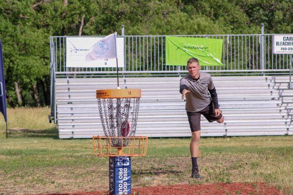 Beginner getting ready to throw a disc golf disc